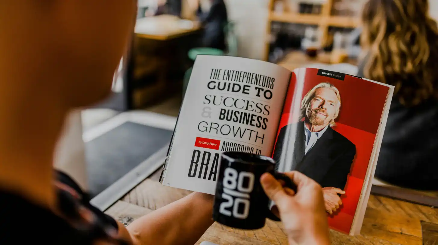 Guy Reading Business Growth Book