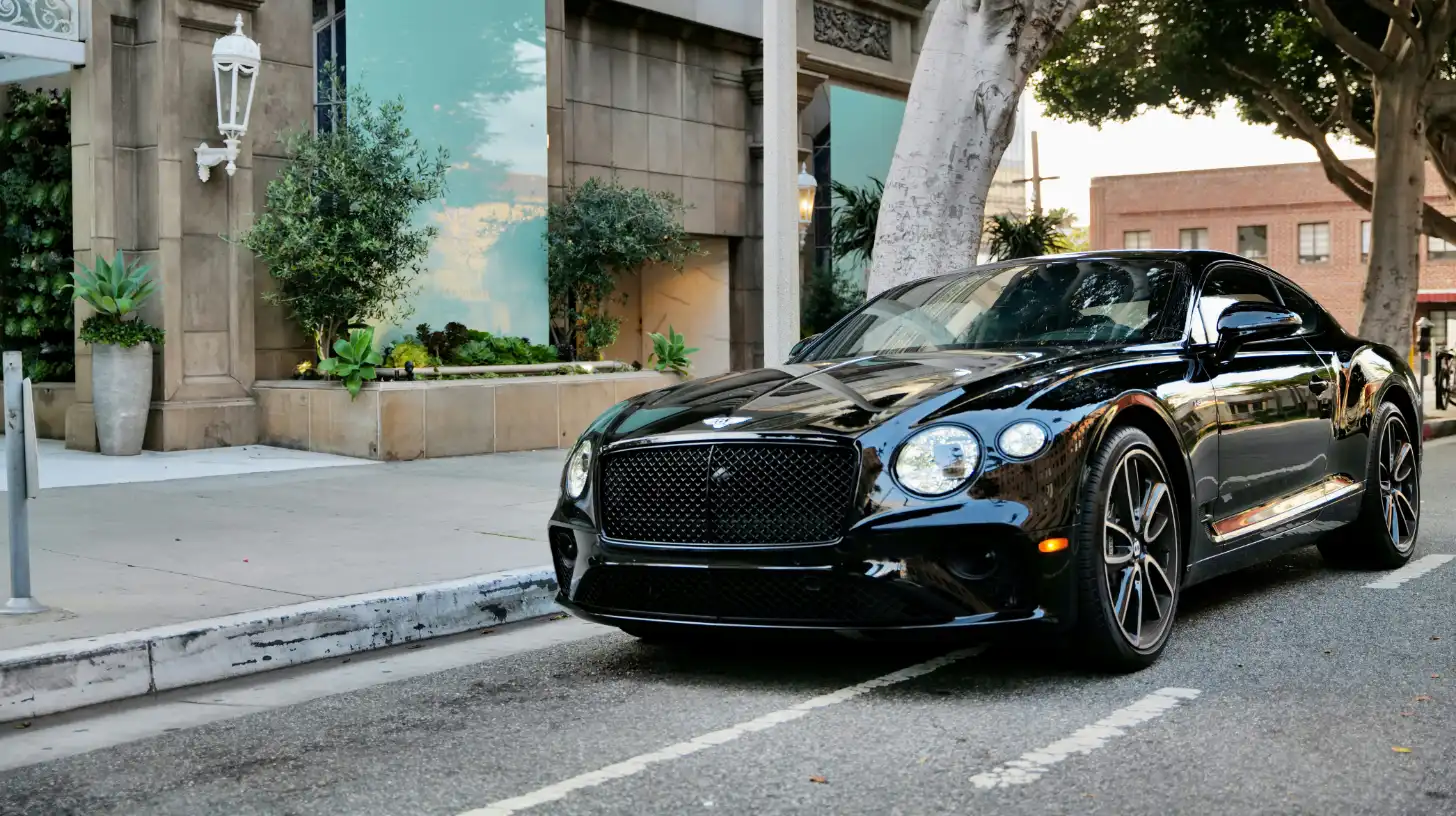 Black Bentley parked out front of shops